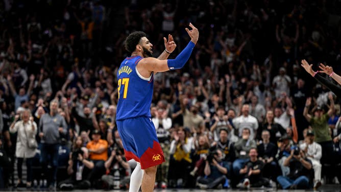 Denver PG Jamal Murray celebrates for the crowd after making a 3-pointer in Suns-Nuggets Game 1 at Ball Arena.