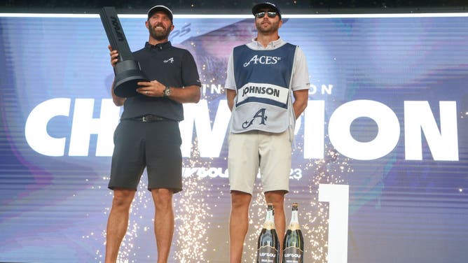 Dustin Johnson of Aces GC celebrates with his caddie and brother, Austin Johnson, after winning the LIV Golf-Tulsa individual championship, but thanks to the CW very few people saw the victory.