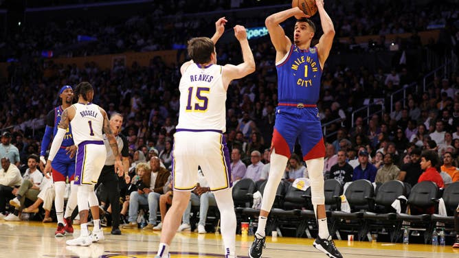 Nuggets wing Michael Porter Jr shoots the ball over Reaves at Crypto.com Arena in Los Angeles.
