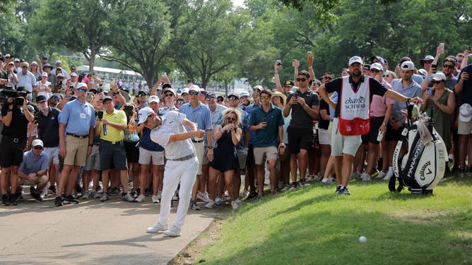Emiliano Grillo of Argentina hits a shot on the 18th hole from the cart path during the final round of the Charles Schwab Challenge at Colonial Country Club on May 28, 2023 in Fort Worth, Texas.