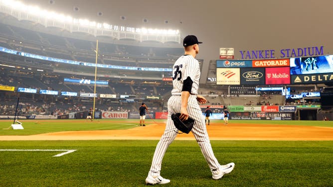 Yankees righty Clarke Schmidt walks on the field before a game vs. the Chicago White Sox at Yankee Stadium.
