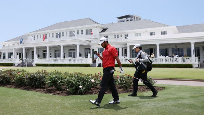 Hideki Matsuyama walks through the Los Angeles Country Club during a practice round prior to the 123rd U.S. Open.