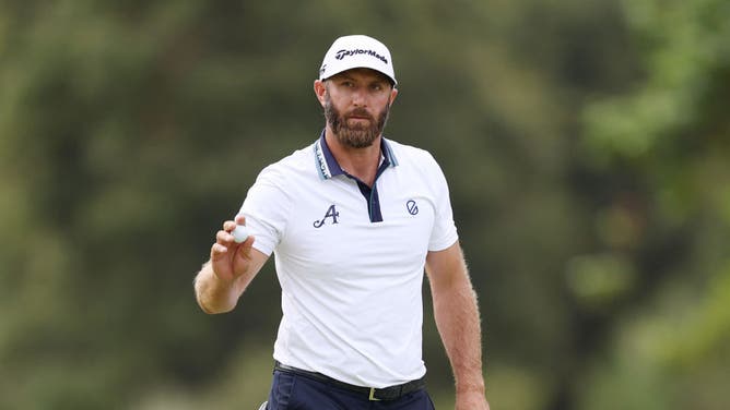 Dustin Johnson reacts to his putt on the seventh green during the first round of the 123rd U.S. Open Championship at The Los Angeles Country Club.