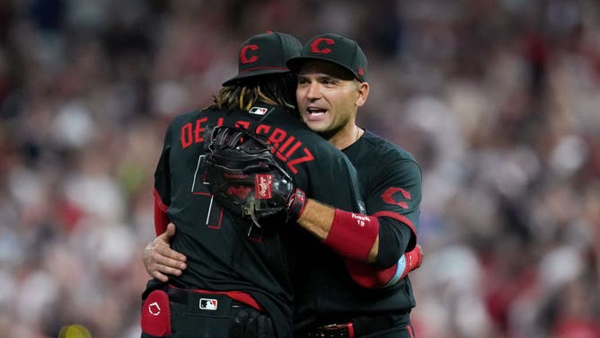 Elly De La Cruz and Joey Votto of the Cincinnati Reds celebrate after beating the Atlanta Braves.