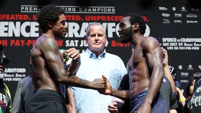 Errol Spence Jr. shakes hands with Terrence Crawford during their weigh-in at T-Mobile Arena in Las Vegas.