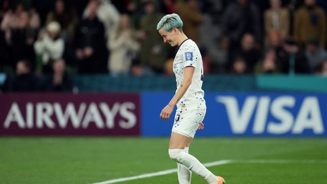 Megan Rapinoe smiles after missing a potential game-winning kick for the USWNT at the World Cup because she's probably thinking about all the money the women already