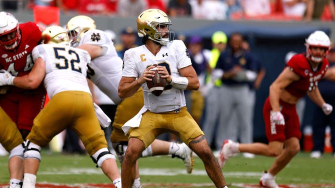Notre Dame QB Sam Hartman drops back to pass against the NC State Wolfpack at Carter-Finley Stadium in Raleigh, North Carolina.