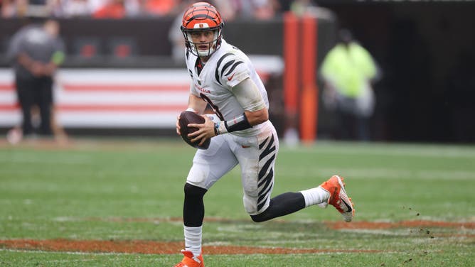 Cincinnati Bengals QB Joe Burrow scrambles against the Cleveland Browns at Cleveland Browns Stadium.