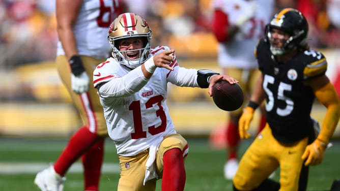 San Francisco 49ers QB Brock Purdy reacts after running for a 1st down vs. the Steelers at Acrisure Stadium in Pittsburgh, Pennsylvania.