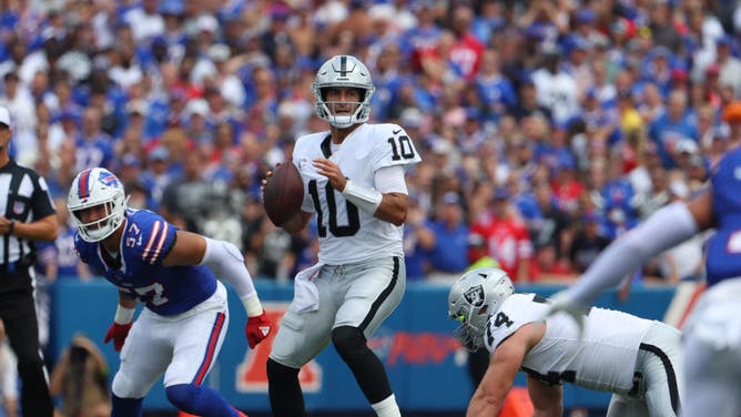 Las Vegas Raiders QB Jimmy Garoppolo drops back to pass vs. the Buffalo Bills at Highmark Stadium in Orchard Park, New York.
