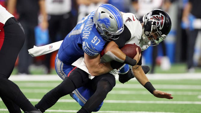 Lions pass rusher Aidan Hutchinson sacks Falcons QB Desmond Ridder at Ford Field in Detroit.