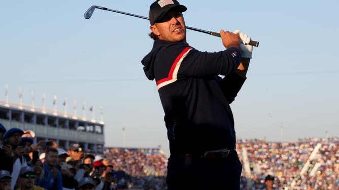 Brooks Koepka plays his second shot on the 1st hole in his Saturday morning foursomes match in the 2023 Ryder Cup at Marco Simone Golf Club.