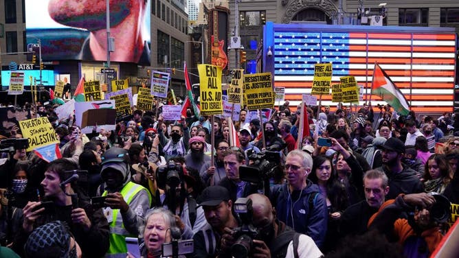 There were protests against Israel and America helping Israel on Sunday near Times Square.