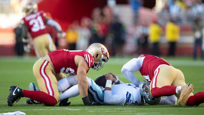 San Francisco 49ers defensive linemen Arik Armstead and Nick Bosa sack Dallas Cowboys QB Dak Prescott at Levi's Stadium in Santa Clara, California.