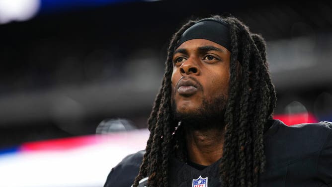 Davante Adams of the Las Vegas Raiders looks on from the sideline prior to a game.