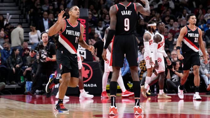 Portland Trail Blazers PG Malcolm Brogdon and PF Jerami Grant celebrate vs. the Raptors at the Scotiabank Arena in Toronto, Ontario, Canada.