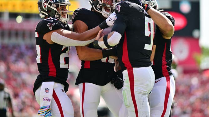 Ridder celebrates with teammates after scoring vs. the Tampa Bay Buccaneers at Raymond James Stadium.