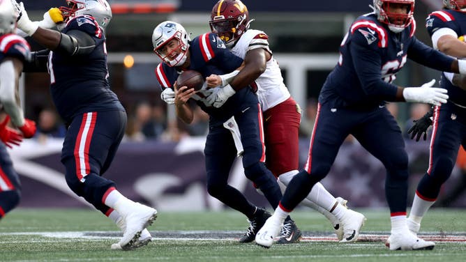 Referees flagged Washington Commanders defender KJ Henry for roughing the passer on Patriots QB Mac Jones, an egregious call.