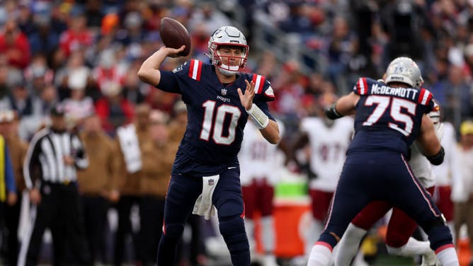 New England Patriots QB Mac Jones throws a pass against the Washington Commanders at Gillette Stadium in Foxborough, Massachusetts.