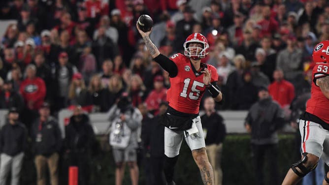 Bulldogs QB Carson Beck passes the ball against the Ole Miss Rebels at Sanford Stadium in Athens, Georgia.