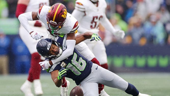NFL referees ejected Emmanuel Forbes of the Washington Commanders for this hit on Tyler Lockett of the Seattle Seahawks during the first quarter of their Week 10 game.