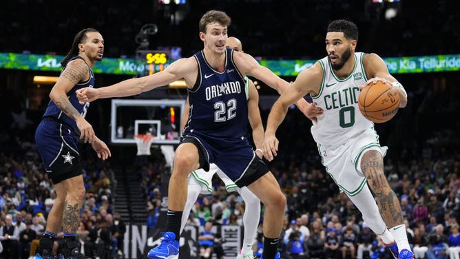 Boston Celtics All-Star Jayson Tatum dribbles to the basket on the Magic at Amway Center in Orlando, Florida.