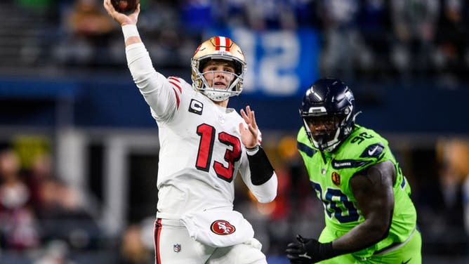 San Francisco 49ers QB Brock Purdy goes downfield in a game against the Seahawks at Lumen Field in Seattle, Washington.