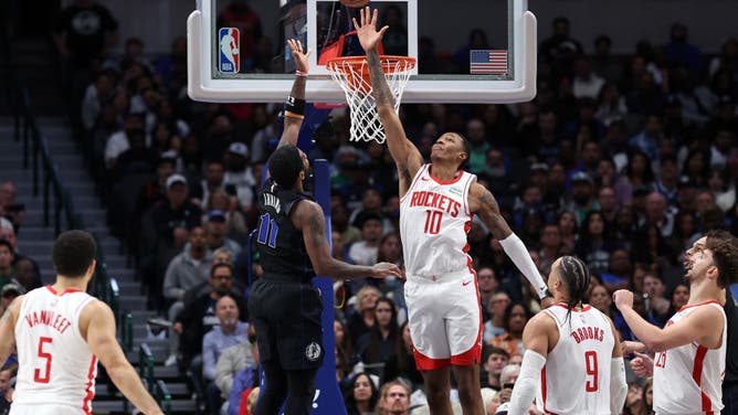 Mavericks SG Kyrie Irving shoots a floater over Houston Rockets PF Jabari Smith Jr. during an NBA In-Season Tournament game at American Airlines Center in Dallas.