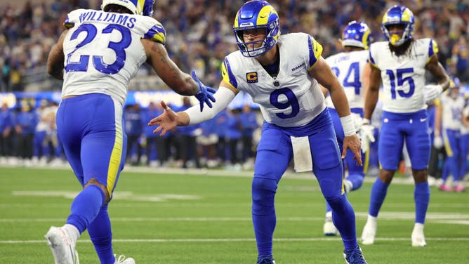 Rams QB Matthew Stafford daps up RB Kyren Williams during a 36-19 win vs. the Cleveland Browns at SoFi Stadium in Inglewood, California.