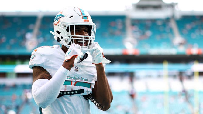 Jaylen Waddle of the Miami Dolphins warms up prior to an NFL football game against the New York Jets at Hard Rock Stadium.