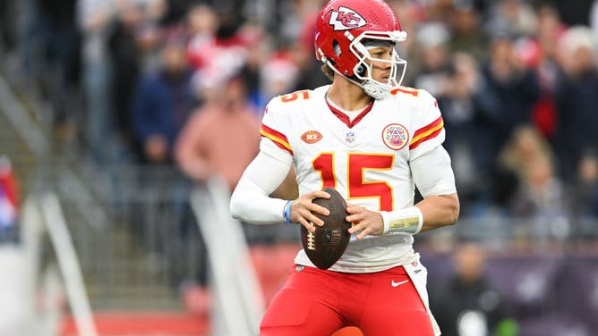 Patrick Mahomes of the Kansas City Chiefs looks to throw the football during the first half against the New England Patriots at Gillette Stadium.