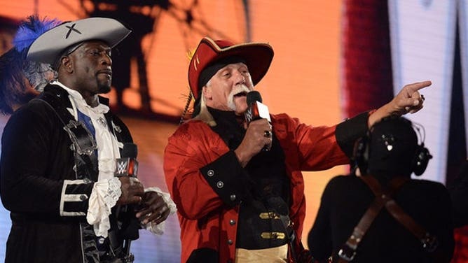 Apr 11, 2021; Tampa, Florida, USA; Titus O'Neil (left) and Hulk Hogan address fans during WrestleMania 37 at Raymond James Stadium.