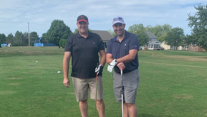 My dad and I with our golf clubs in Erie, Pennsylvania.