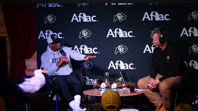 Deion Sanders chats with Mark Johnson during his Colorado coach's show on Wednesday, sitting next to the Aflac duck.
Courtesy of Colorado Athletics