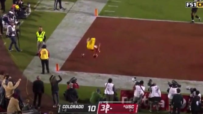 USC backup punter does amazing backflip.