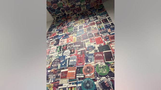 Credential wallpaper inside a Hotel Rock Lititiz room. The credentials are from tours worked by the Rock Lititz team.