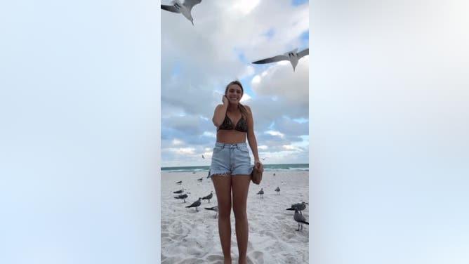 Bird Unties Bikini Top