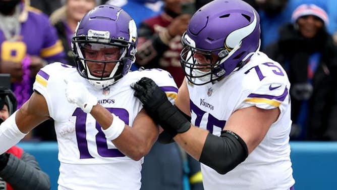 Justin Jefferson, #18 of the Minnesota Vikings, celebrates with Brian O'Neill, #75 of the Minnesota Vikings, after Jefferson's touchdown during the first quarter against the Buffalo Bills at Highmark Stadium on Nov. 13, 2022 in Orchard Park, New York.