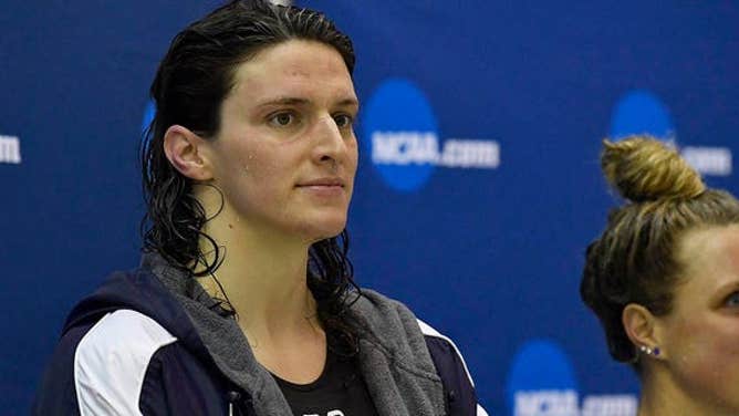 Lia Thomas, left, looks on from the podium after finishing fifth in the 200 Yard Freestyle during the 2022 NCAA Division I Women's Swimming & Diving Championship at the McAuley Aquatic Center on the campus of the Georgia Institute of Technology on March 18, 2022 in Atlanta.
