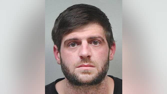 Alabama man Ricky Franks Jr. poses for his mugshot after shooting a neighbor's house over the Alabama-Tennessee game outcome