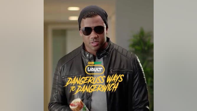 Russell Wilson congratulates Geno Smith.