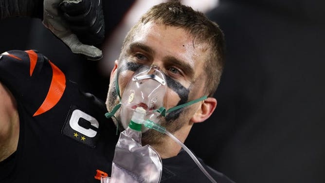 Bengals defensive end Sam Hubbard uses oxygen after his 98-yard touchdown run on Jan. 15, 2023, in Cincinnati.