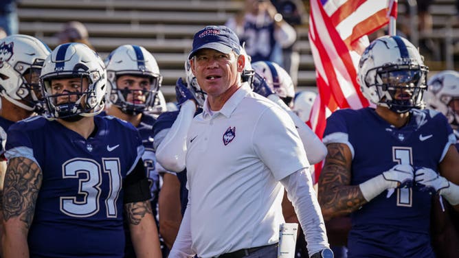 UConn Huskies coach Jim Mora before the start of the game vs. the Liberty Flames at Rentschler Field.