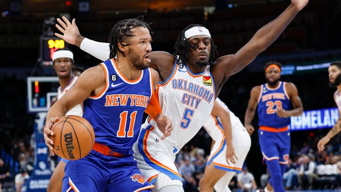 New York Knicks PG Jalen Brunson drives to the hole on Thunder SF Luguentz Dort at Paycom Center in Oklahoma City.