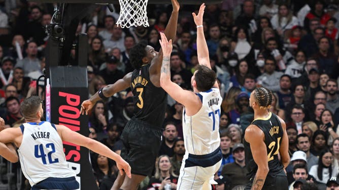 Raptors SF OG Anunoby blocks a shot by Dallas Mavericks PG Luka Doncic at Scotiabank Arena in Toronto, Canada.
