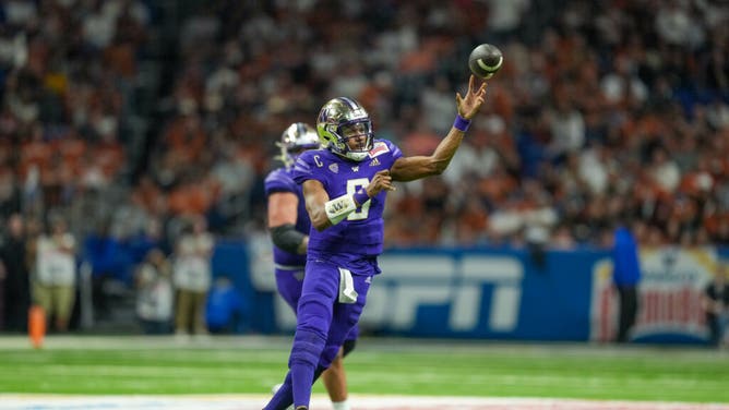 Washington Huskies QB Michael Penix Jr. throws a pass in the 2022 Alamo Bowl vs. the Texas Longhorns at the Alamodome in San Antonio.