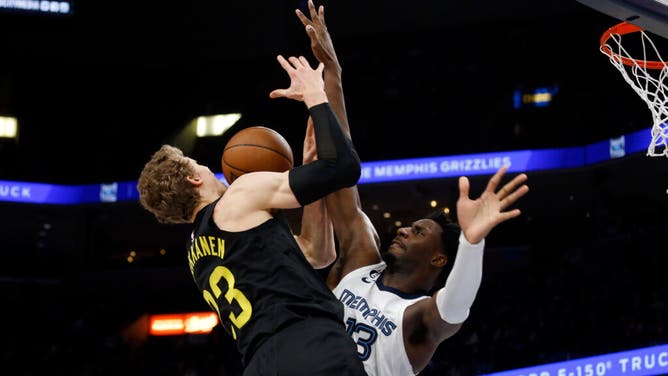 Utah Jazz PF Lauri Markkanen drives to the basket on Grizzlies PF Jaren Jackson Jr. at FedExForum in Memphis, Tennessee.