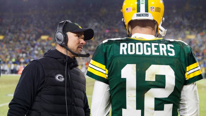 Green Bay Packers head coach Matt LaFleur talks with QB Aaron Rodgers during the 4th quarter vs. the Detroit Lions at Lambeau Field.