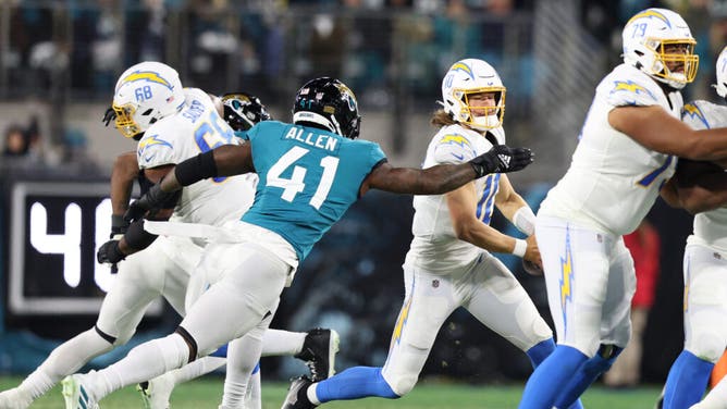 Jaguars edge rusher Josh Allen sacks Los Angeles Chargers QB Justin Herbert in the AFC wild card game at TIAA Bank Field in Jacksonville, Florida.