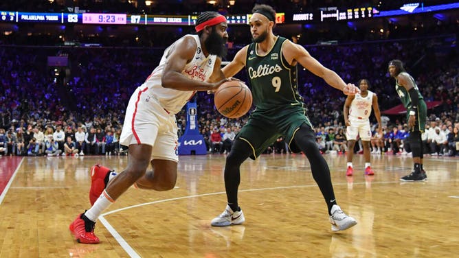 76ers PG James Harden drives to the basket against Celtics G Derrick White at Wells Fargo Center.